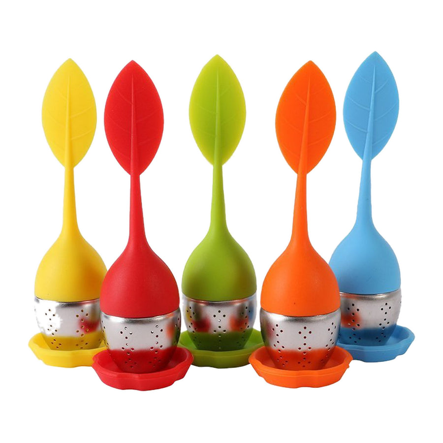 Five silicone leaf tea infusers in yellow, red, green, orange and blue, each with a stainless steel mesh basket and matching silicone drip tray, on a white background